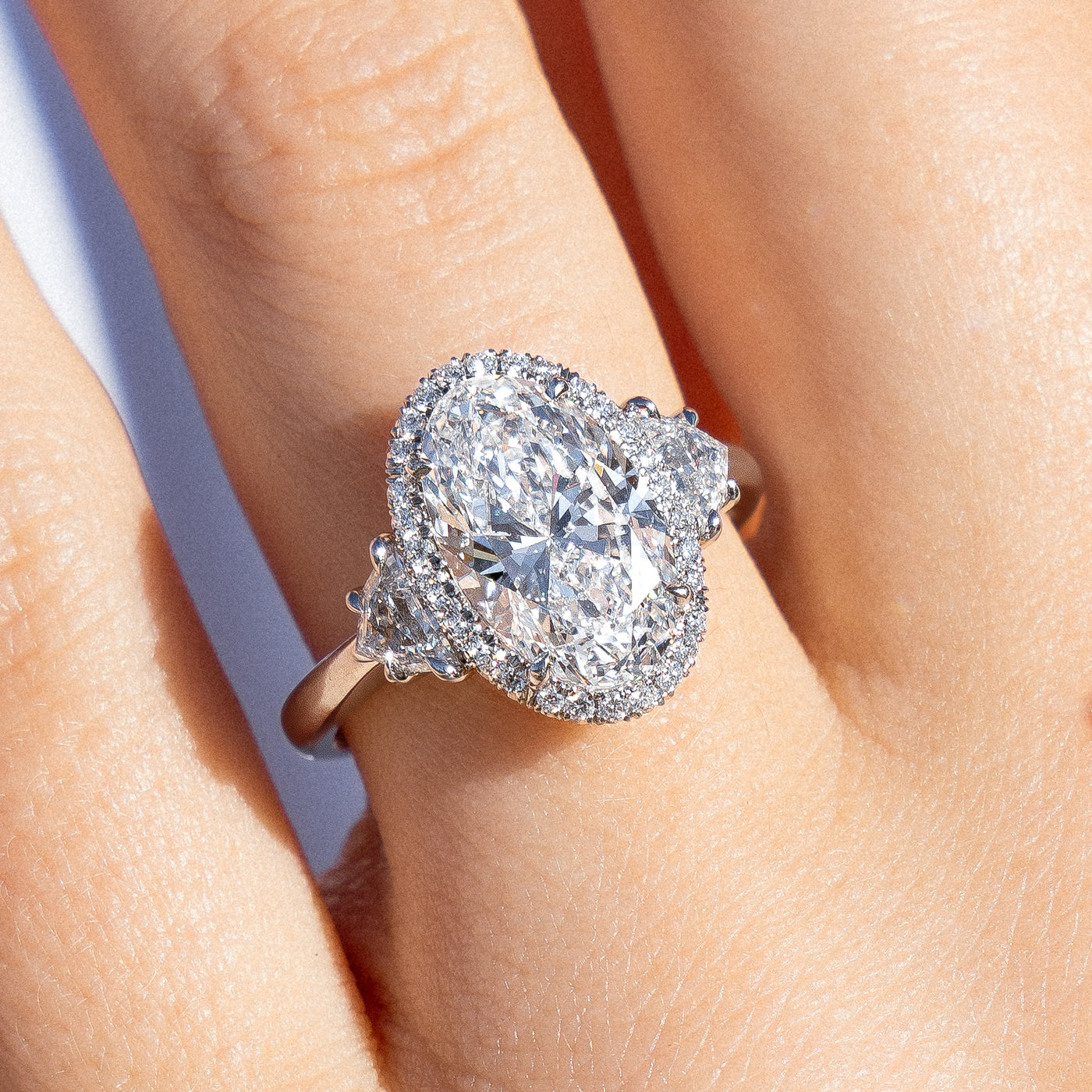 Oval Diamond Three Stone Halo Ring | 4.20tw